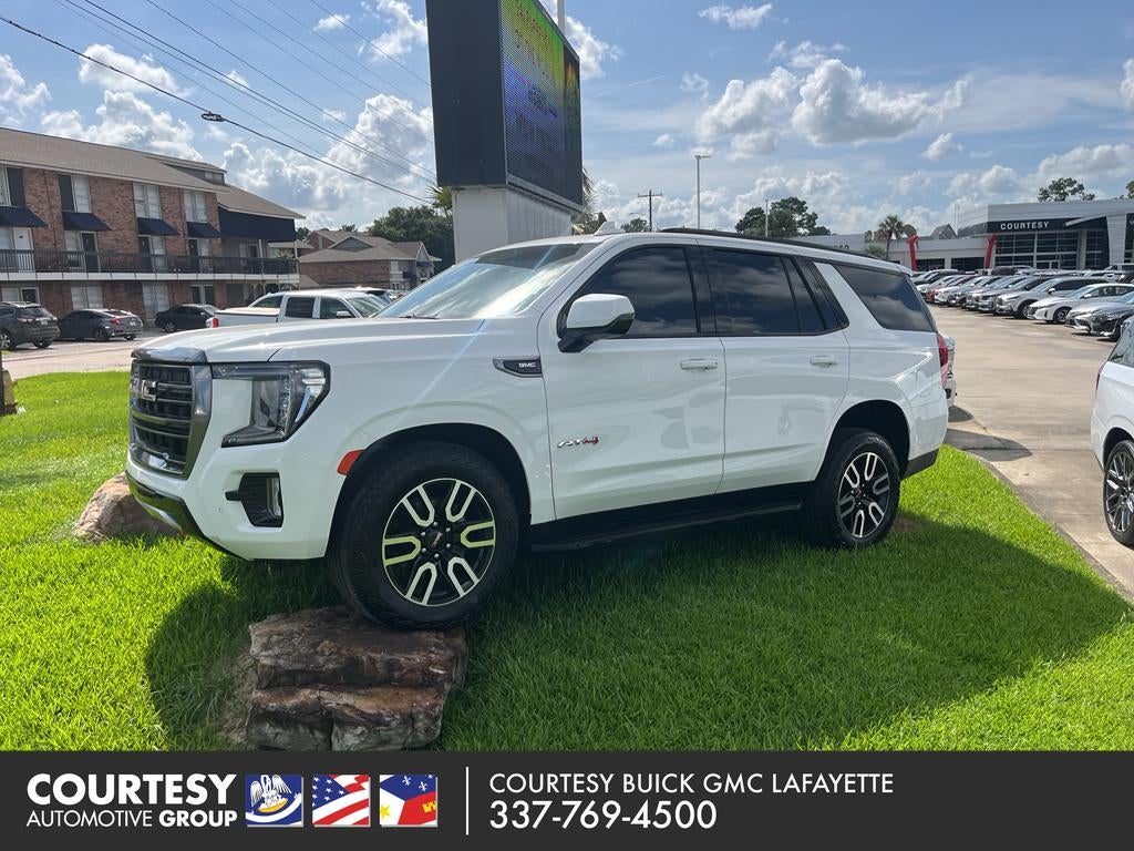 2023 GMC Yukon AT4 in Summit White — front three-quarter view