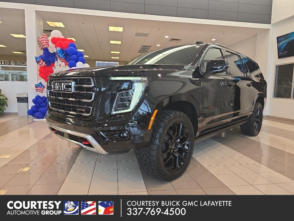 2026 GMC Yukon XL AT4 in Onyx Black — front three-quarter view