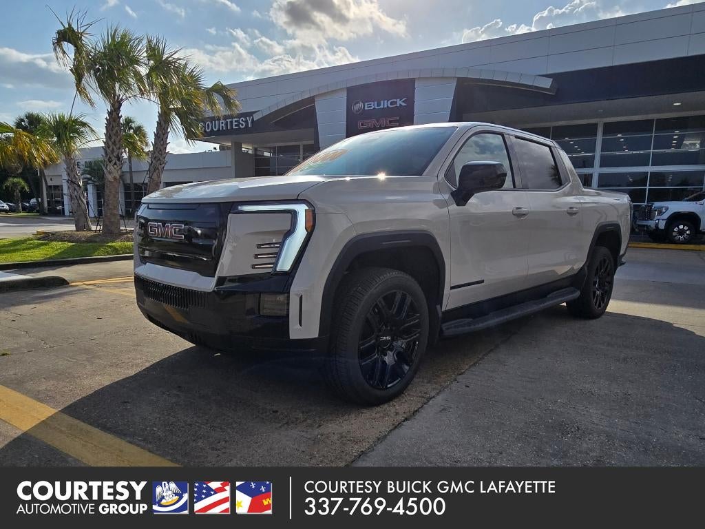 2026 GMC Sierra EV Elevation Extended Range in Coastal Dune — front three-quarter view