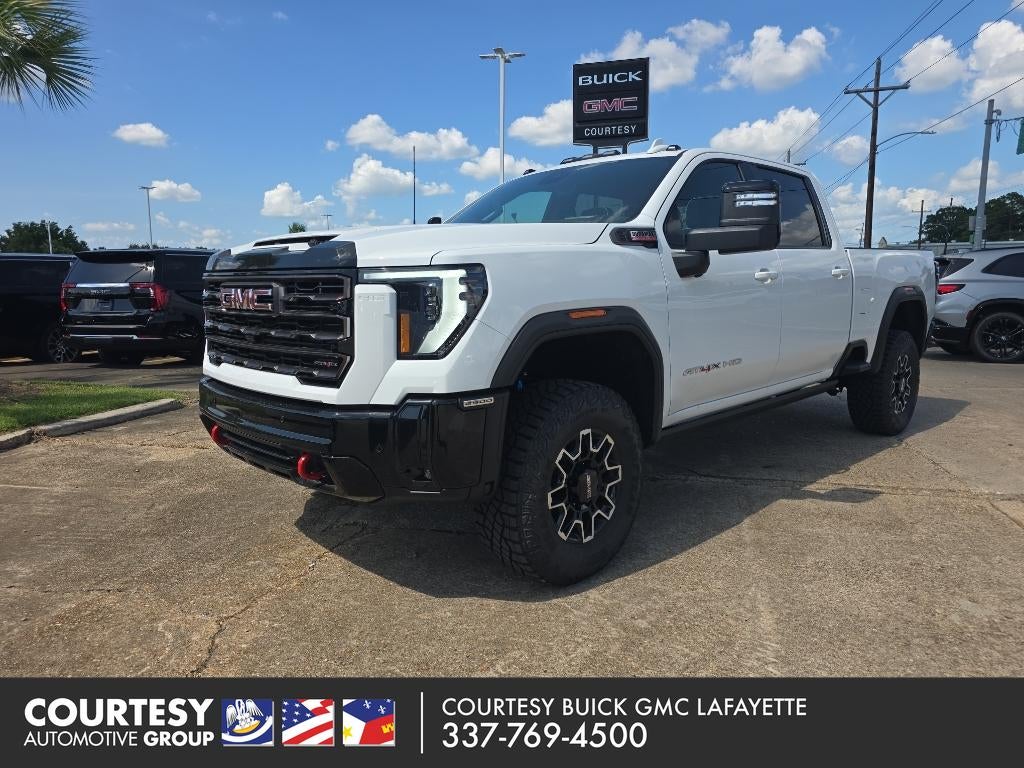 2026 GMC Sierra 2500 HD AT4X in Summit White — front three-quarter view