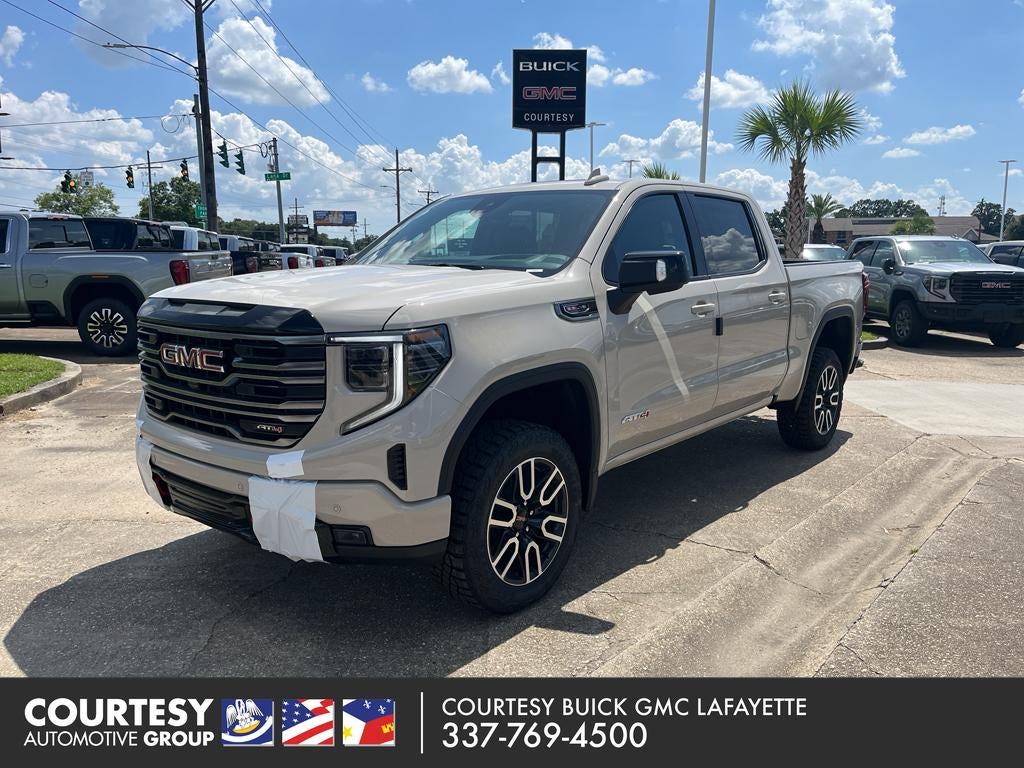 2026 GMC Sierra 1500 AT4 in Coastal Dune — front three-quarter view